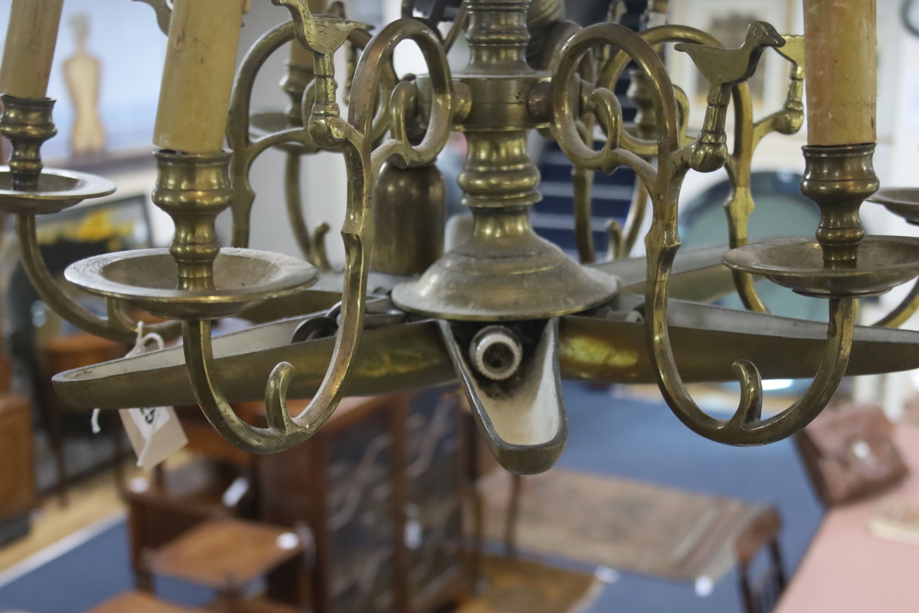 A 19th century Dutch brass six-light electrolier with star-shaped base and drop